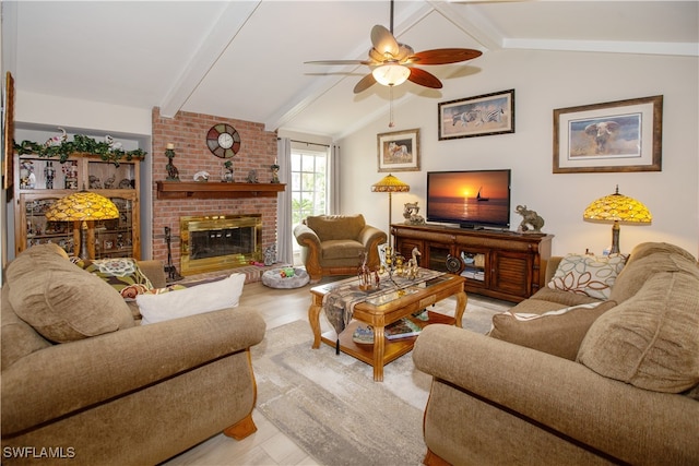 living room with light hardwood / wood-style floors, a brick fireplace, vaulted ceiling with beams, and ceiling fan