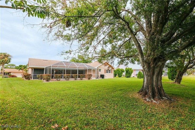 view of yard with a lanai