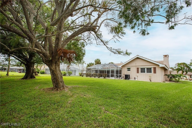 view of yard featuring a lanai