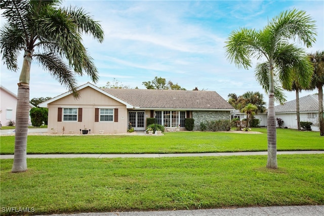 single story home featuring a front yard