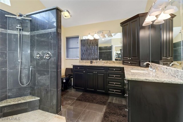 2822 SE 22nd Pl, Cape Coral, FL 33904 - bathroom featuring vanity, a tile shower, and tile patterned floors