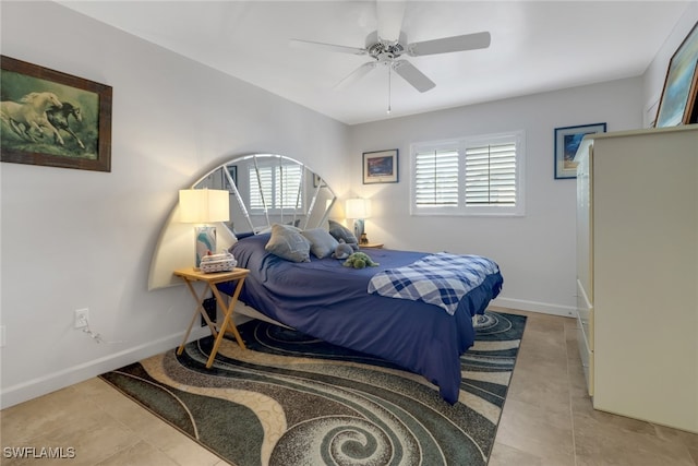 bedroom with ceiling fan, multiple windows, and light tile patterned floors