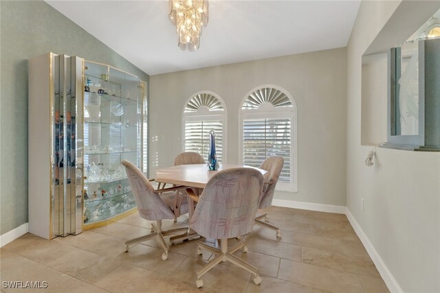 2822 SE 22nd Pl, Cape Coral, FL 33904 - tiled dining area featuring baseboards, a chandelier, and lofted ceiling