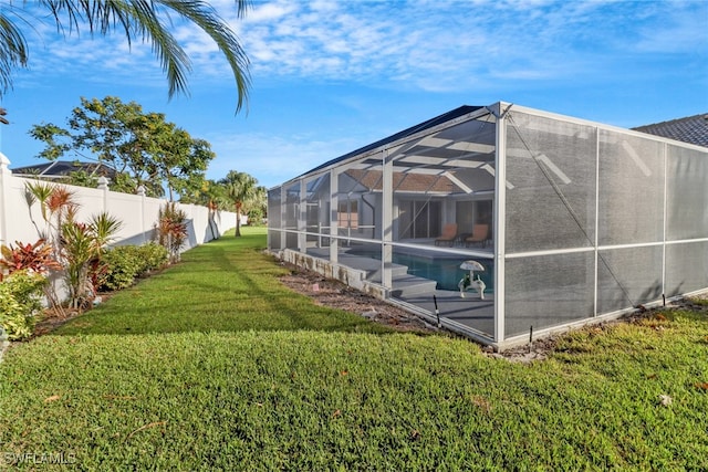 view of yard featuring a lanai and a fenced in pool