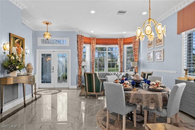 dining room featuring a notable chandelier, ornamental molding, and french doors