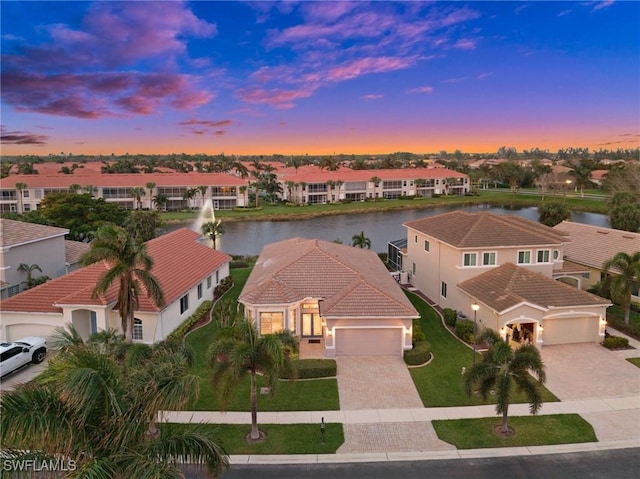 aerial view featuring a residential view and a water view