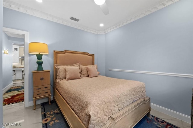 bedroom with ceiling fan and ornamental molding