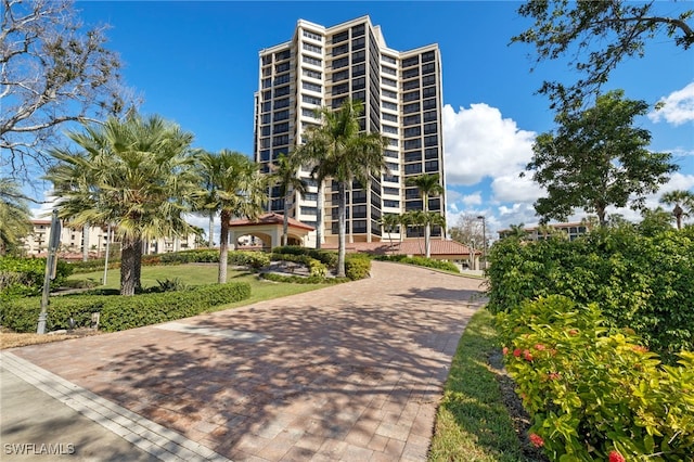 view of property's community with decorative driveway