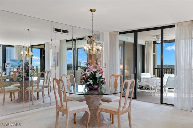 dining room featuring an inviting chandelier, light carpet, and visible vents