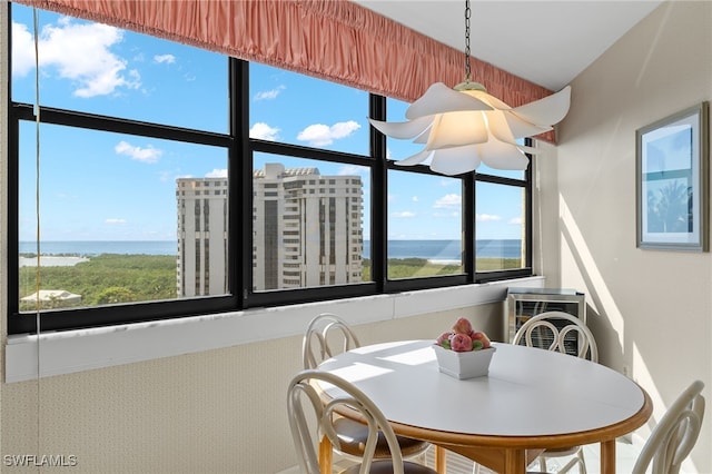dining space featuring a water view