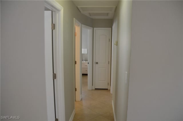 corridor featuring light tile patterned flooring