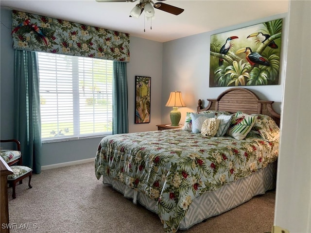 bedroom featuring ceiling fan and carpet