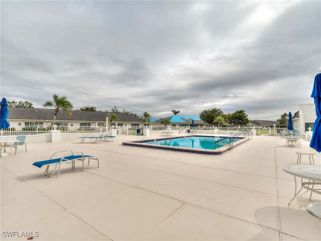 view of pool featuring a patio