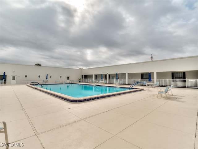 view of swimming pool with a patio area