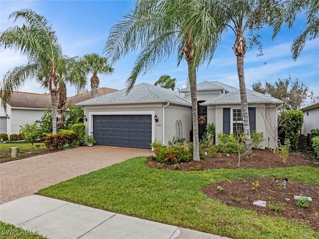 single story home with a garage and a front yard