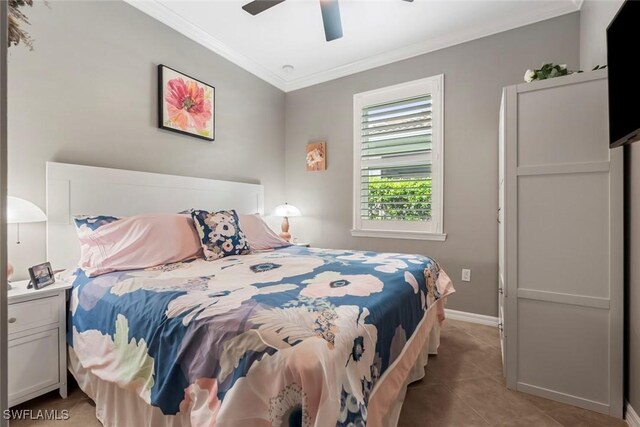 bedroom featuring ornamental molding, light tile patterned flooring, and ceiling fan