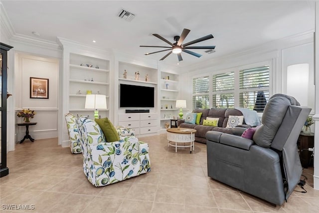 tiled living room with crown molding, ceiling fan, and built in shelves