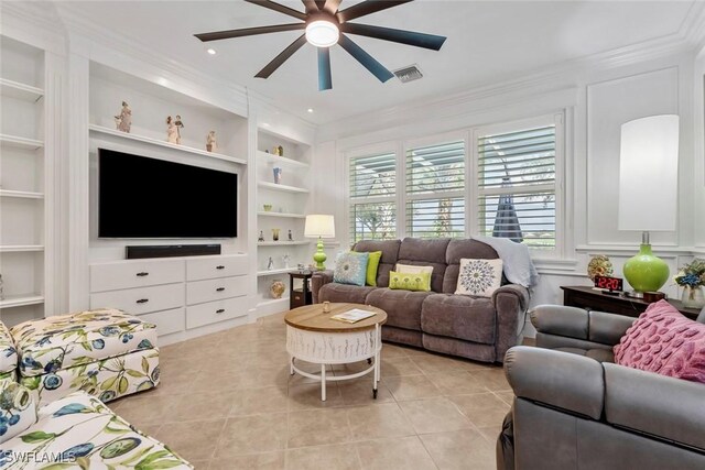 living room featuring ornamental molding, light tile patterned floors, built in features, and ceiling fan