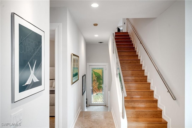 stairway featuring recessed lighting and baseboards