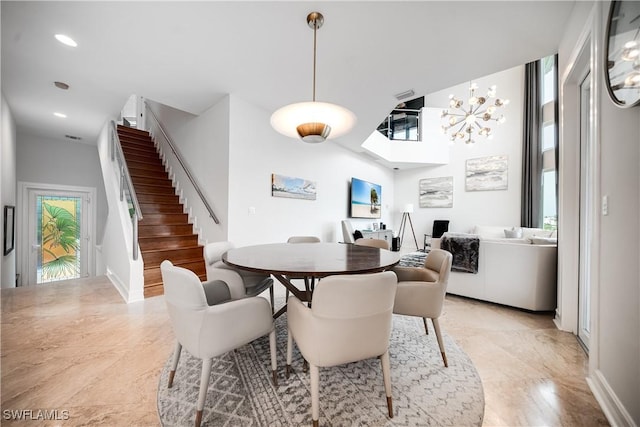 dining space featuring recessed lighting, stairway, plenty of natural light, and baseboards