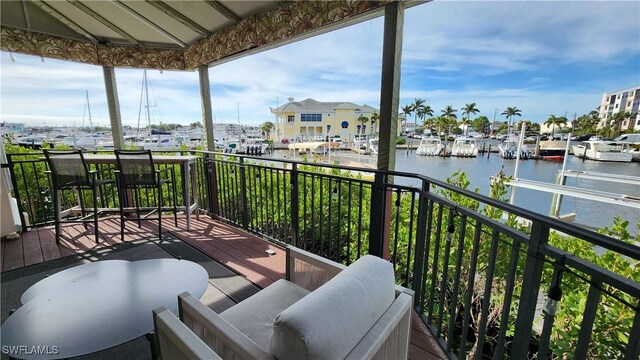 balcony featuring a water view