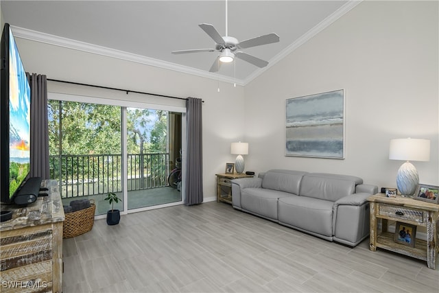 living room featuring ceiling fan, lofted ceiling, and ornamental molding