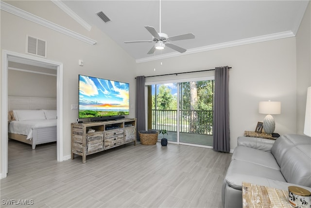 living room featuring vaulted ceiling, ceiling fan, and crown molding