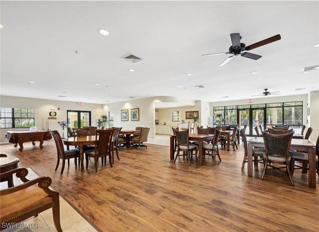 dining space with wood-type flooring, a wealth of natural light, ceiling fan, and billiards