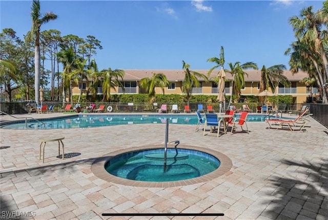 view of pool featuring a hot tub