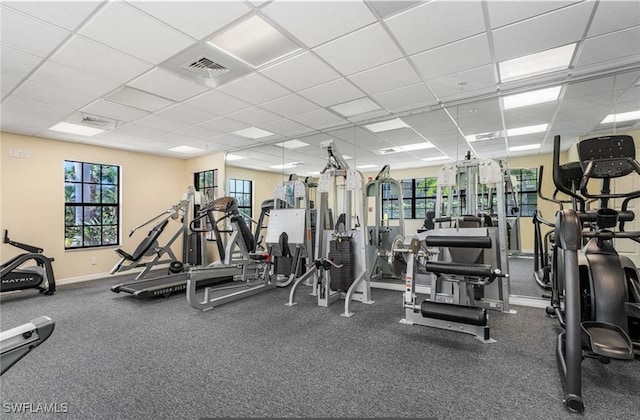 workout area with a paneled ceiling