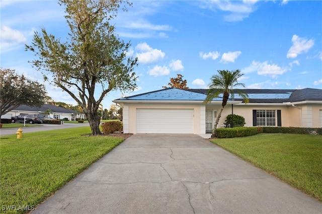 ranch-style house featuring a front yard and a garage