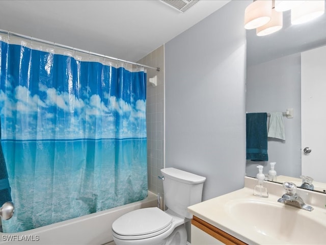 full bathroom with shower / tub combo with curtain, vanity, and toilet