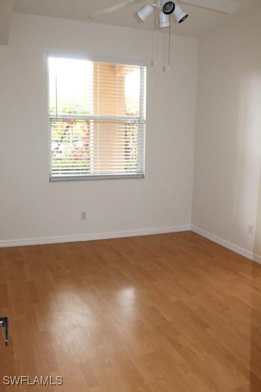 unfurnished room featuring light hardwood / wood-style floors and ceiling fan