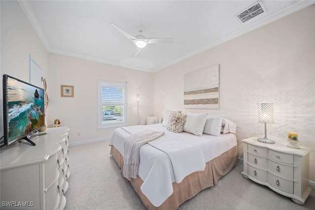 carpeted bedroom featuring ceiling fan and ornamental molding