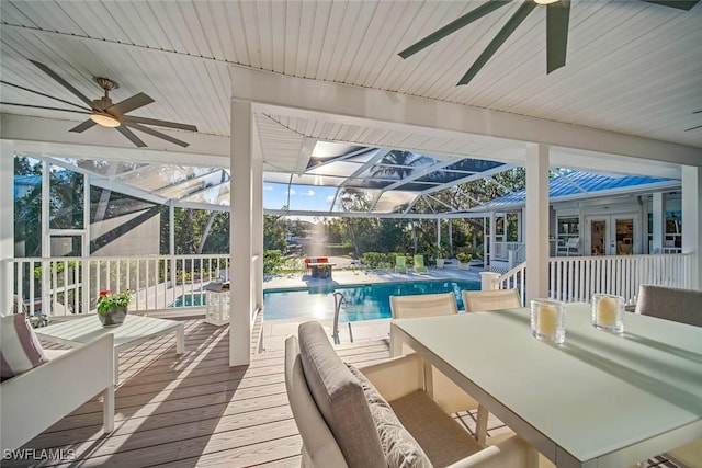 view of pool featuring a lanai, a patio, and french doors