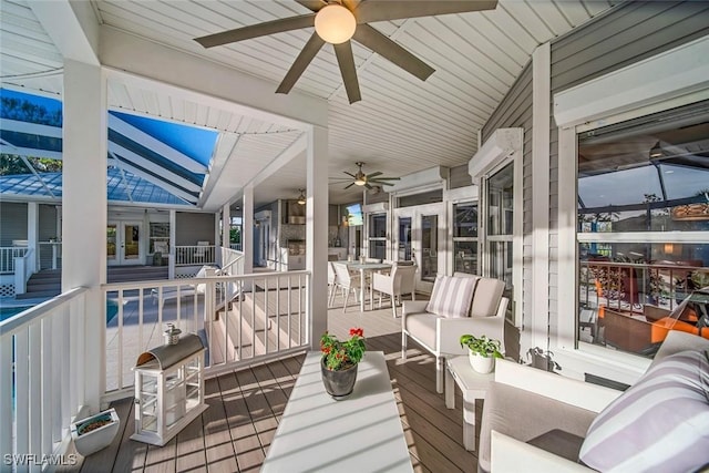 sunroom / solarium featuring vaulted ceiling