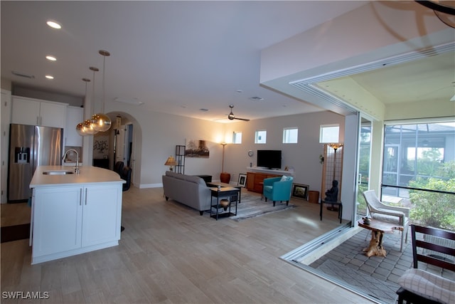 interior space featuring sink and light hardwood / wood-style flooring