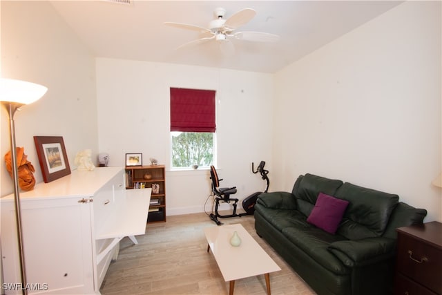 living room with light hardwood / wood-style floors and ceiling fan