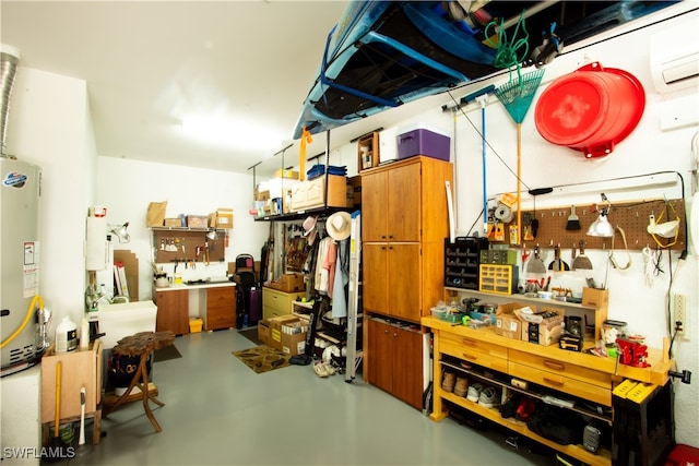 interior space with water heater, a wall mounted AC, and a workshop area