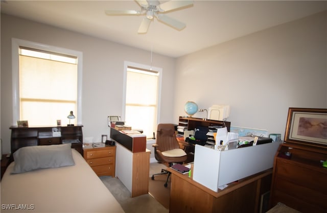 carpeted bedroom with ceiling fan