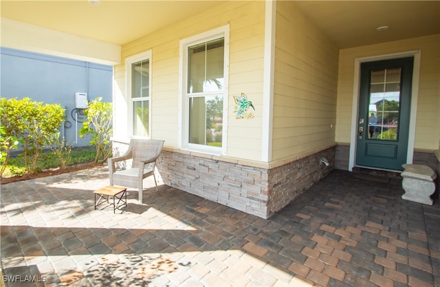 entrance to property with a patio