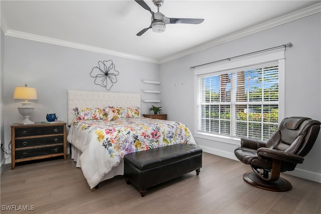 bedroom with ceiling fan, dark hardwood / wood-style flooring, and crown molding