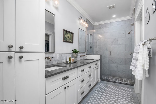 bathroom with tile patterned flooring, vanity, crown molding, and walk in shower