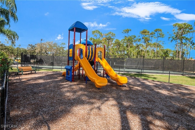 view of playground featuring tennis court