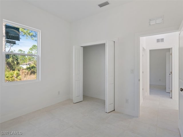 unfurnished bedroom with light tile patterned floors