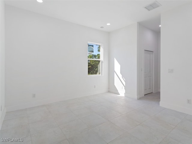 empty room with light tile patterned floors