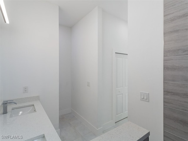 bathroom featuring vanity and tile patterned flooring