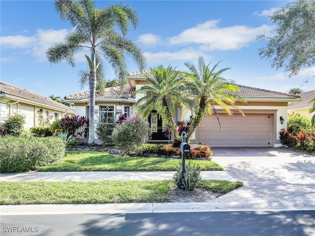 mediterranean / spanish-style home with a garage