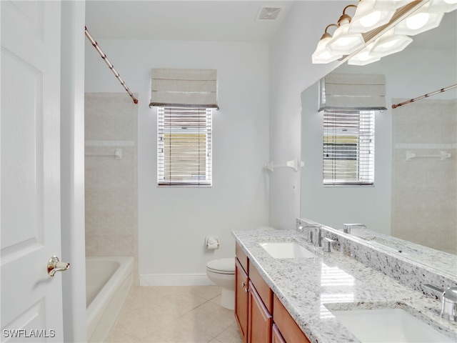 full bathroom with vanity, toilet, a healthy amount of sunlight, and tile patterned flooring