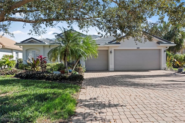 single story home featuring a garage